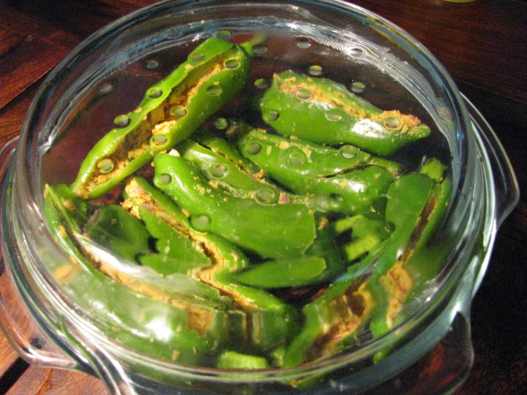 stuffed marcha/mirchi/chilies/mirch in microwave safe bowl with its lid closed