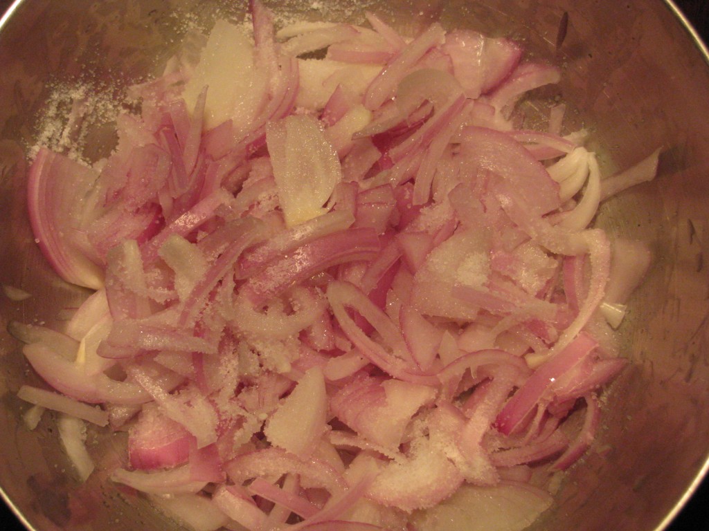 sliced onions with salt 